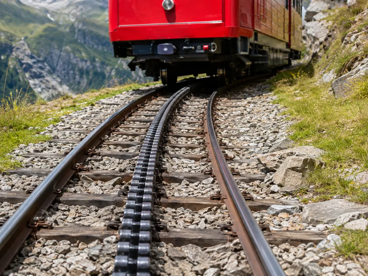 A Gornergrat Bahn cogwheel train climbing above Zermatt